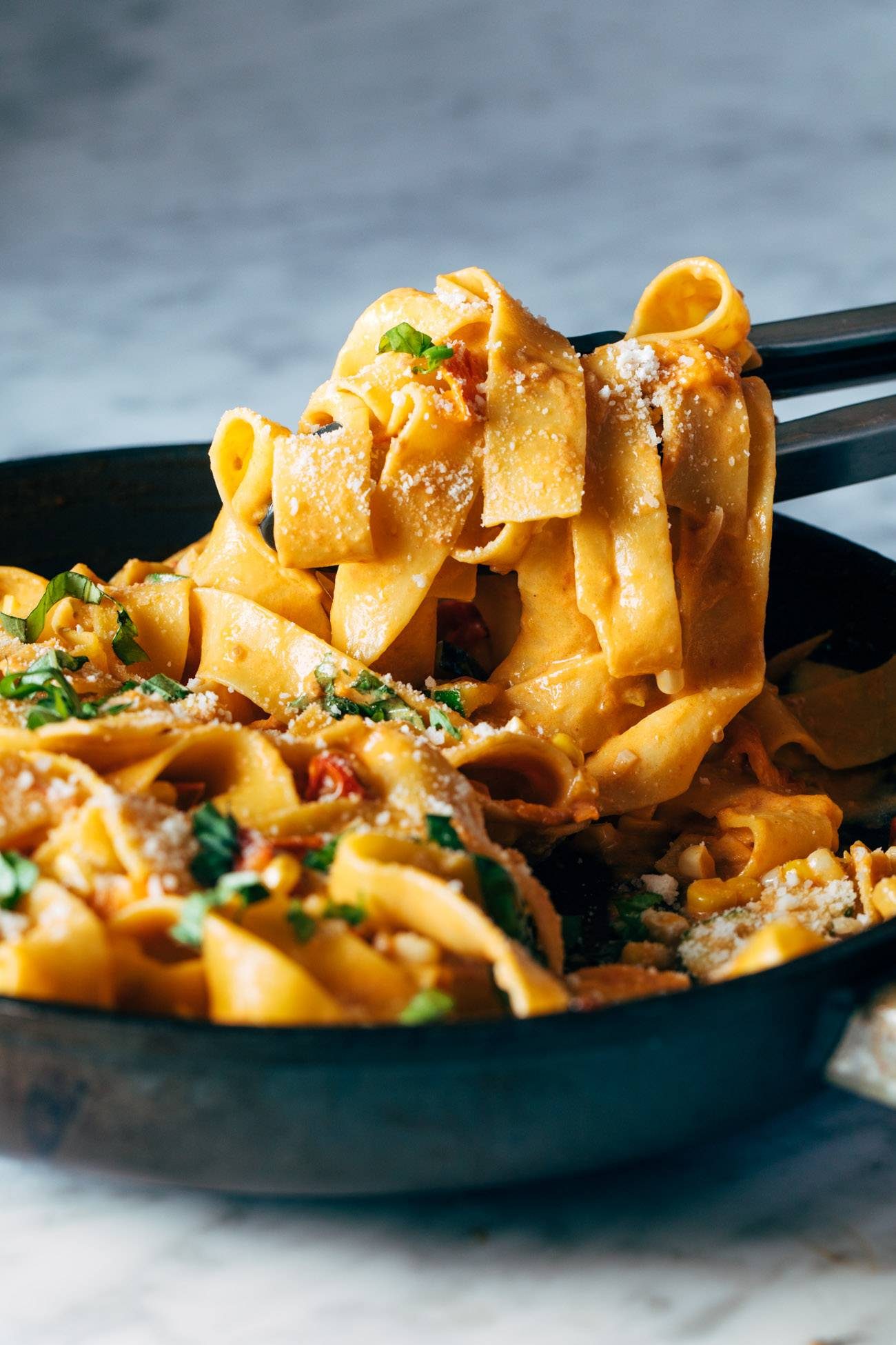 Creamy pappardelle in a skillet.
