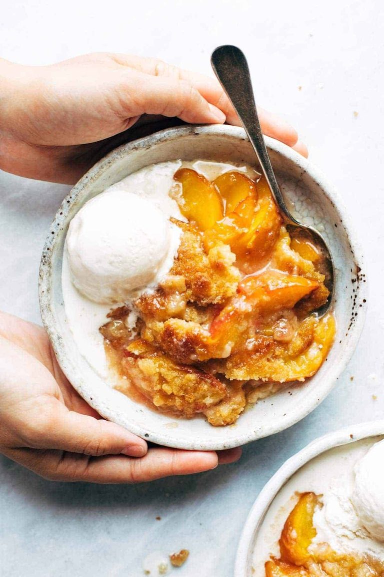 Peach cobbler in a bowl.